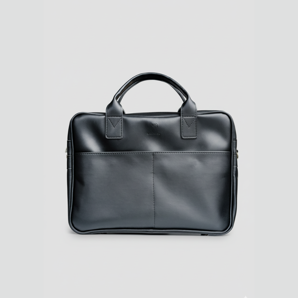Front view of Plant Inside black vegan leather laptop bag – minimalist, timeless design handcrafted in Poland, representing conscious and cruelty-free fashion beyond trends