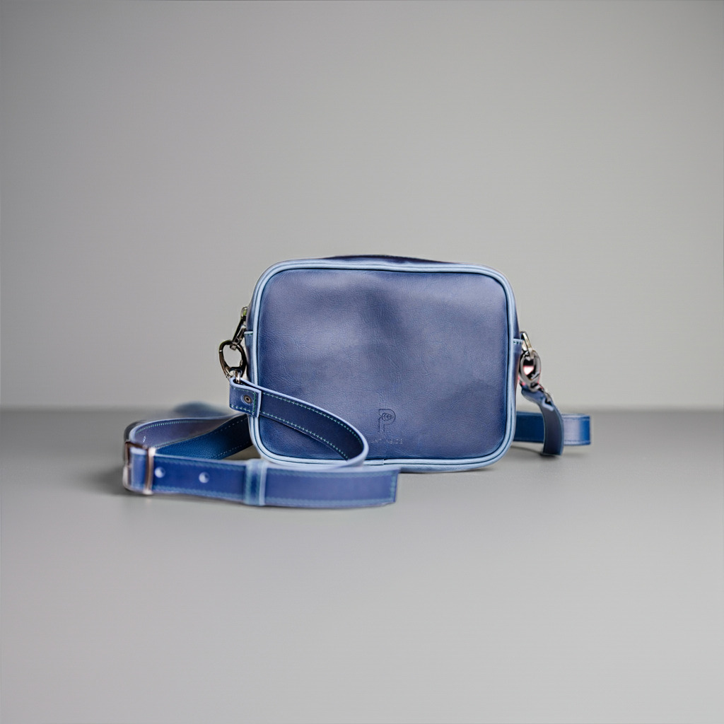 Front view of Plant Inside vegan crossbody bag in navy blue – handcrafted in Europe from plant-based materials made from corn, symbolizing a sustainable journey from field to fashion