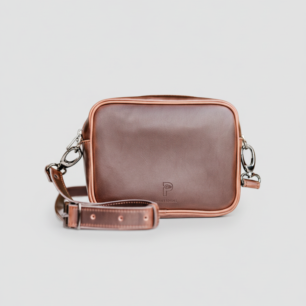 Front view of Plant Inside brown vegan leather crossbody bag – handcrafted, sustainable alternative to fast fashion accessories