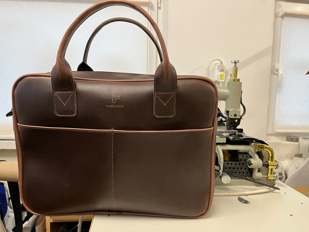 Plant Inside vegan laptop bag freshly crafted in local Polish workshop, next to sewing machine – sustainable and cruelty-free production