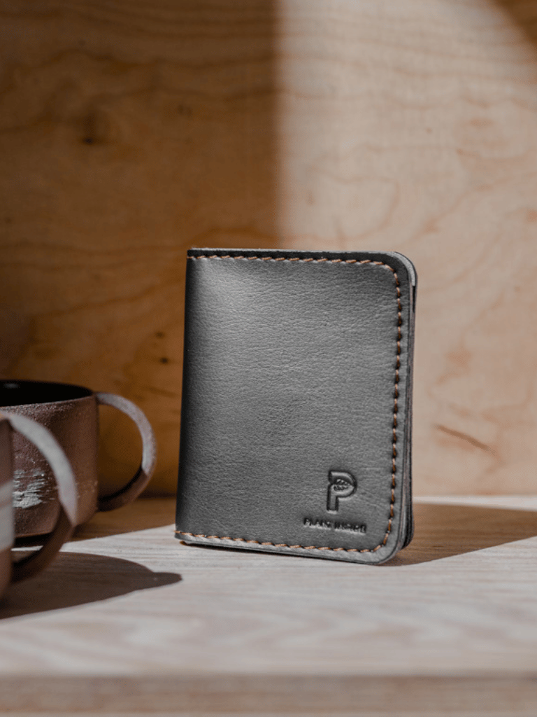 Stylish travel wallet in black matt finish, PETA-certified vegan design