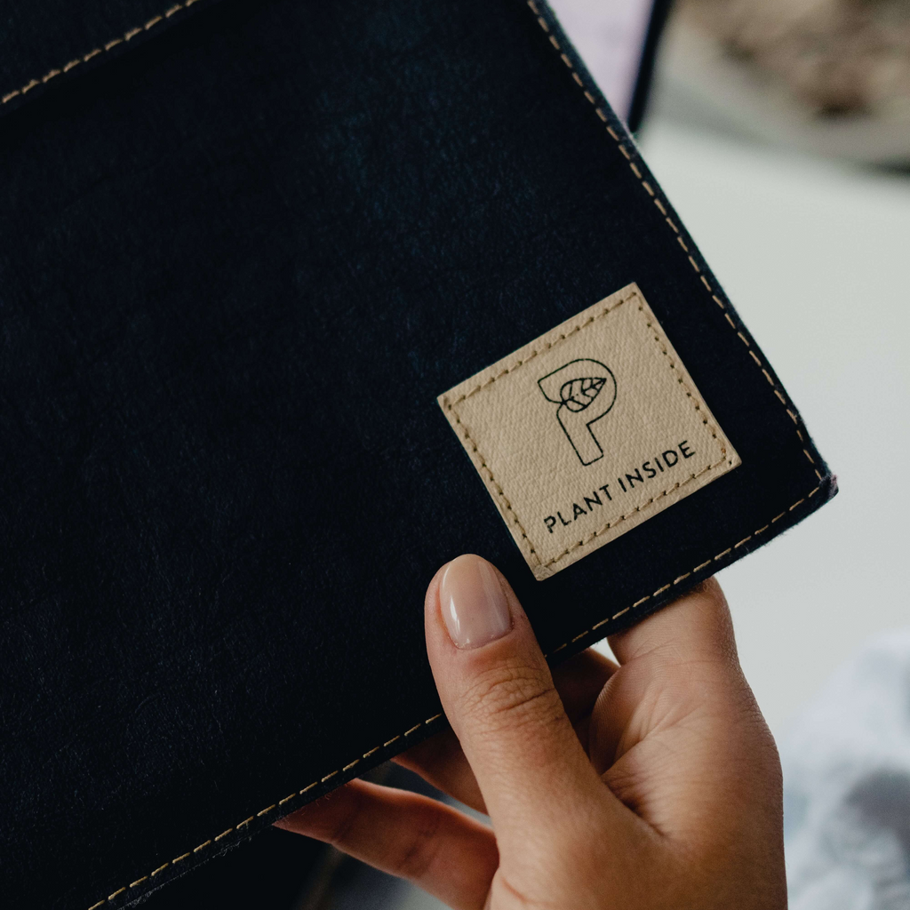 Slim black vegan sleeve designed for 14 or 16-inch MacBook or similar laptops